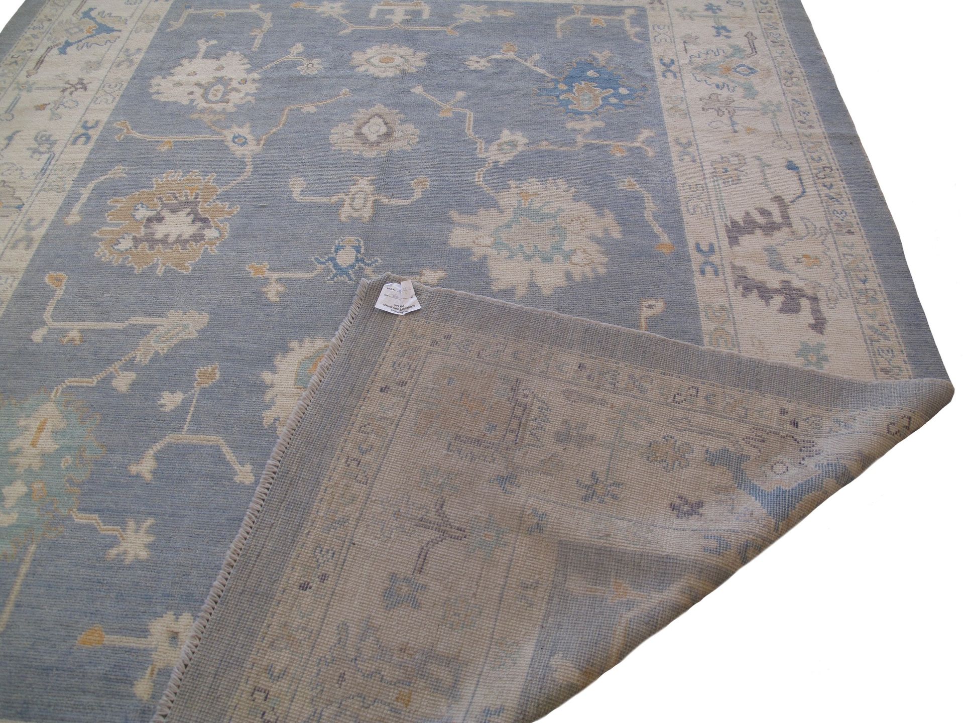A rug with a floral pattern on it is on a white background