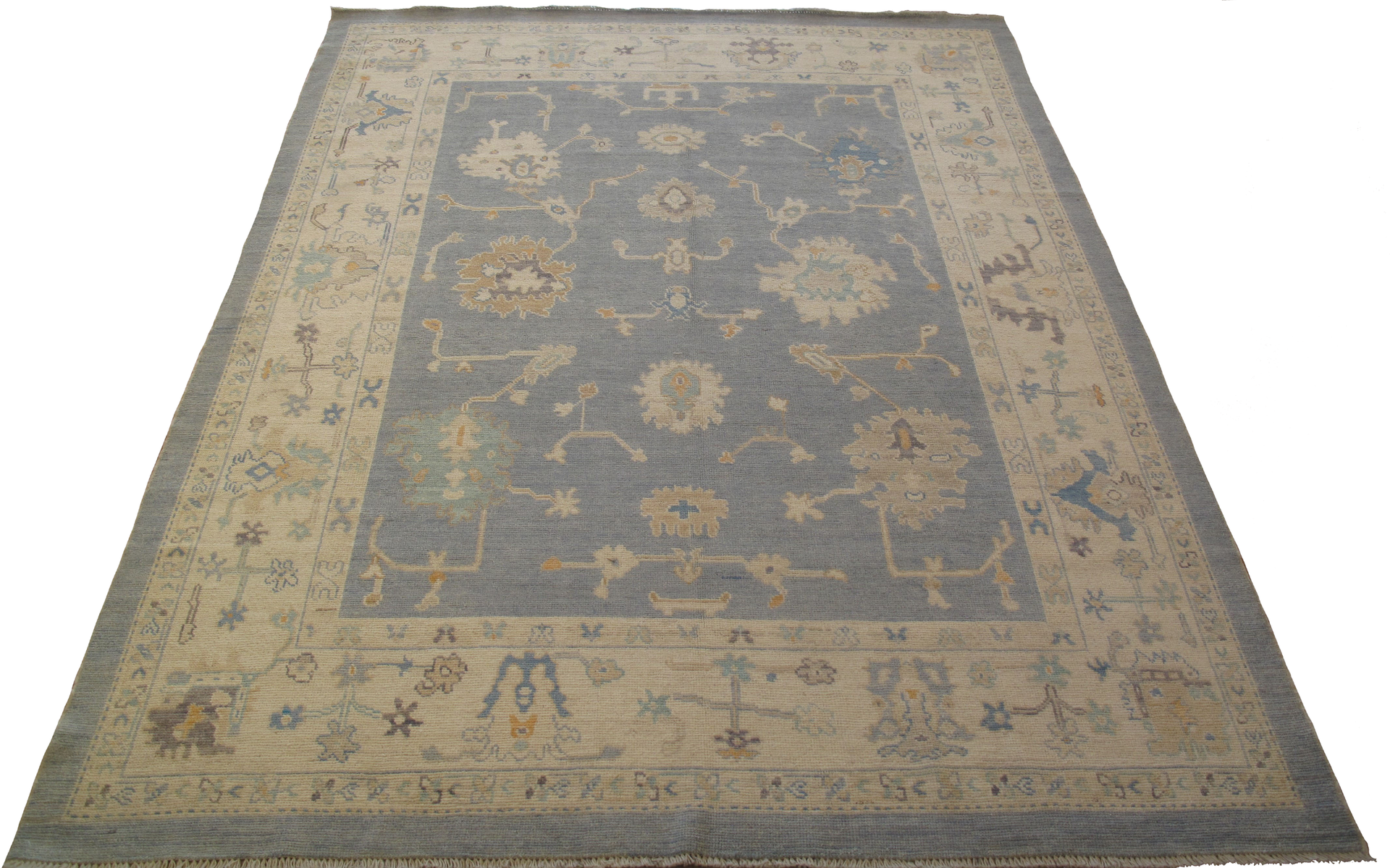 A rug with a floral pattern on it is on a white background