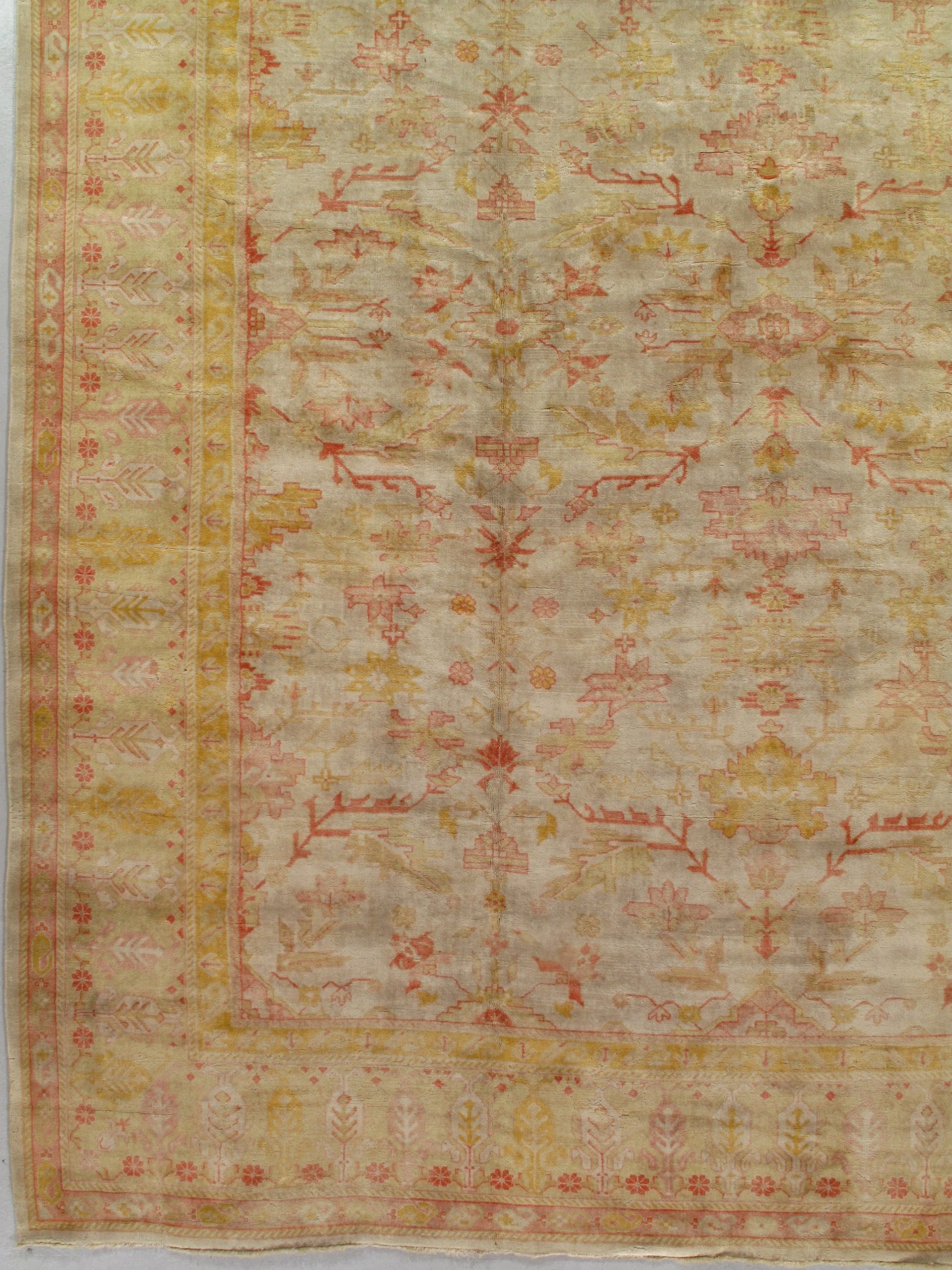 A close up of a rug with a floral pattern on a white surface.
