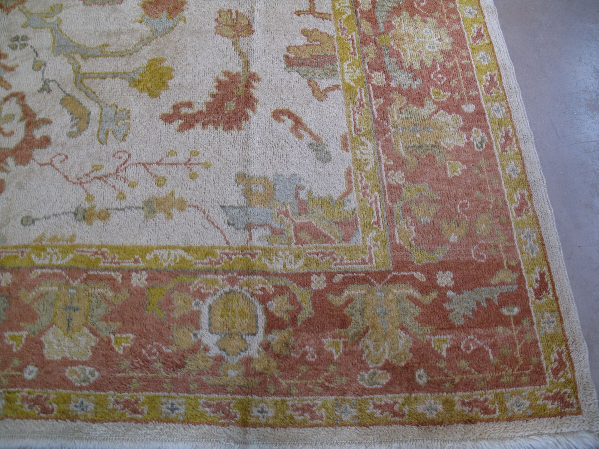A rug with a floral pattern on it is on a white background