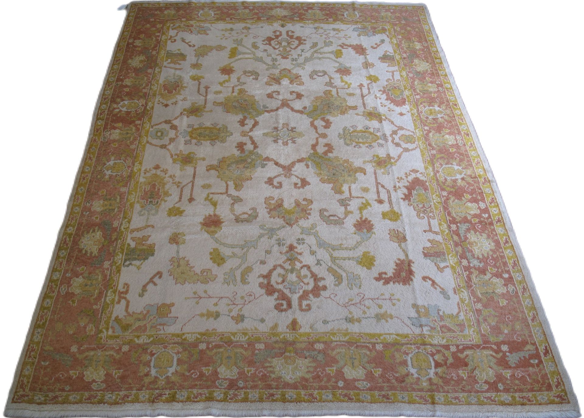 A rug with a floral pattern on it is on a white background