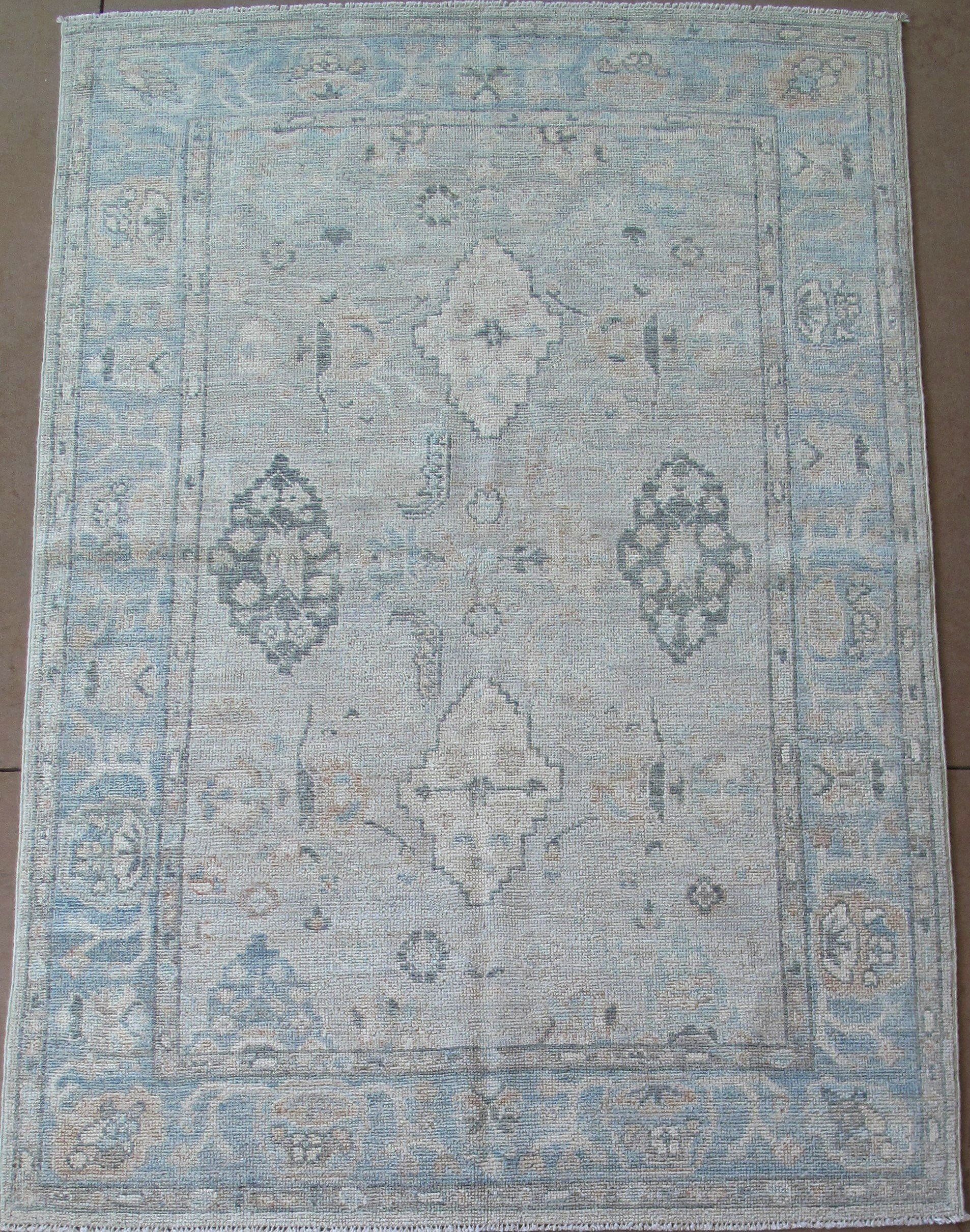 A rug with a pattern on it is sitting on a table.
