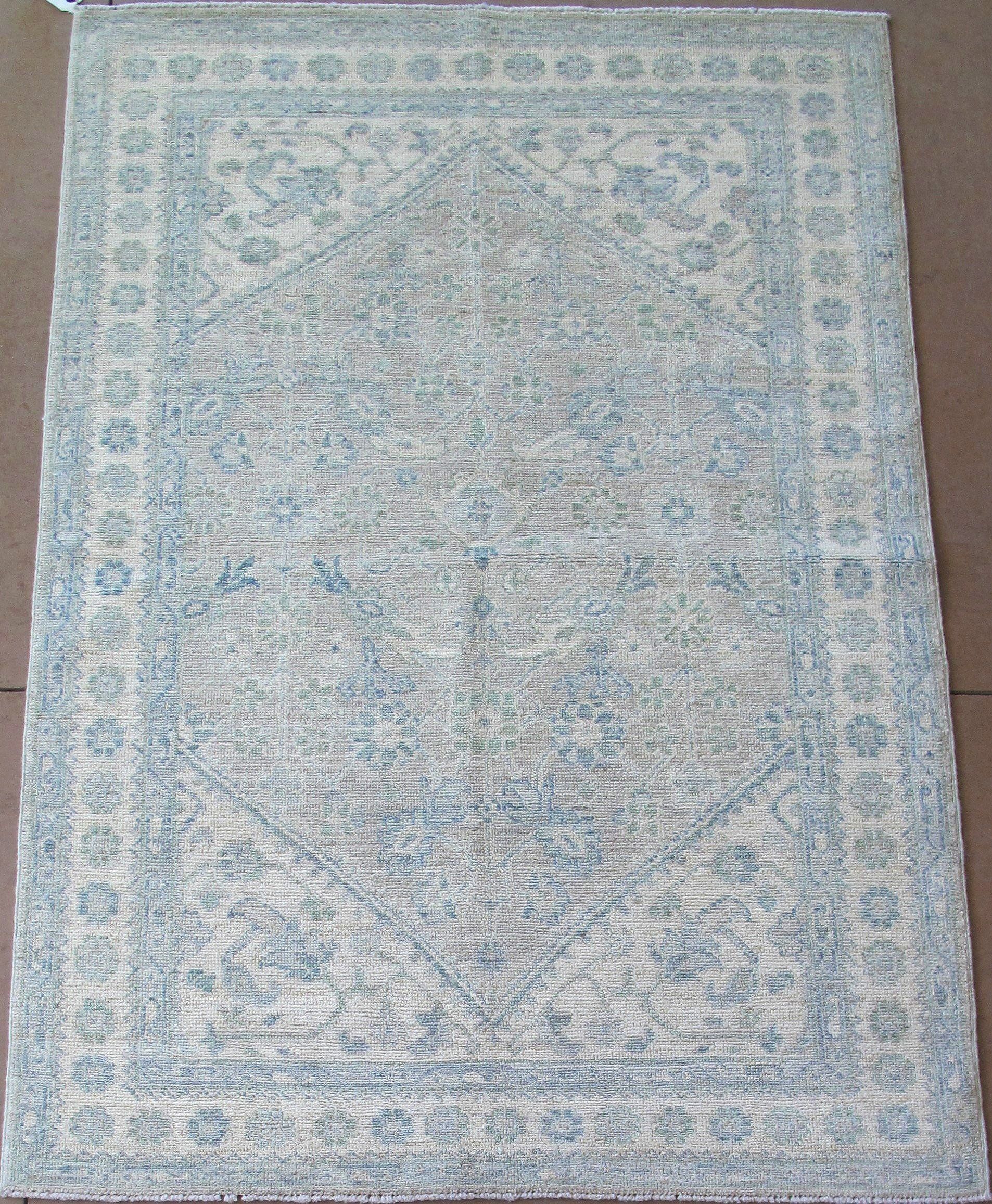 A blue and white rug with a pattern on it