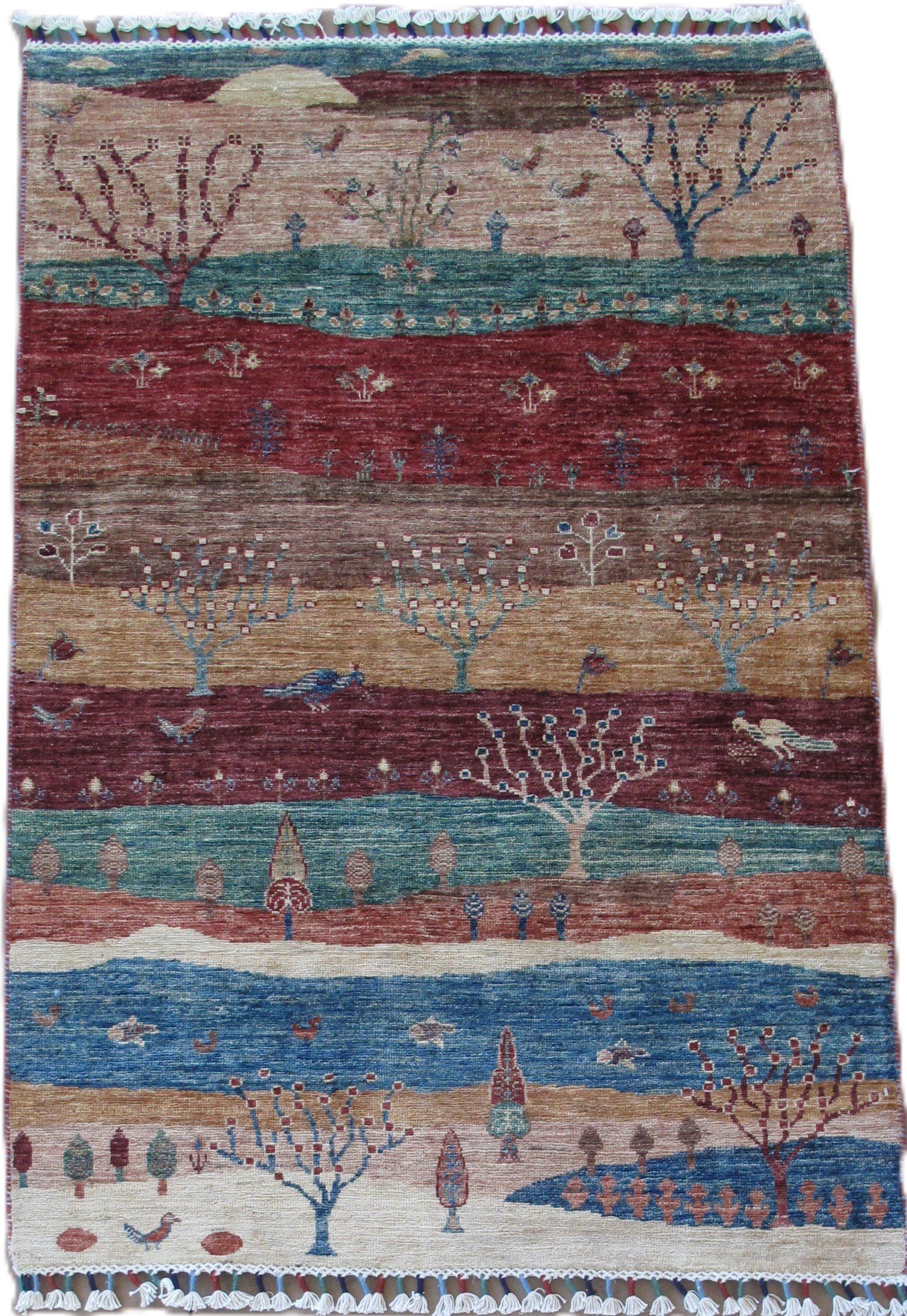 A rug with a painting of trees and a river on it.