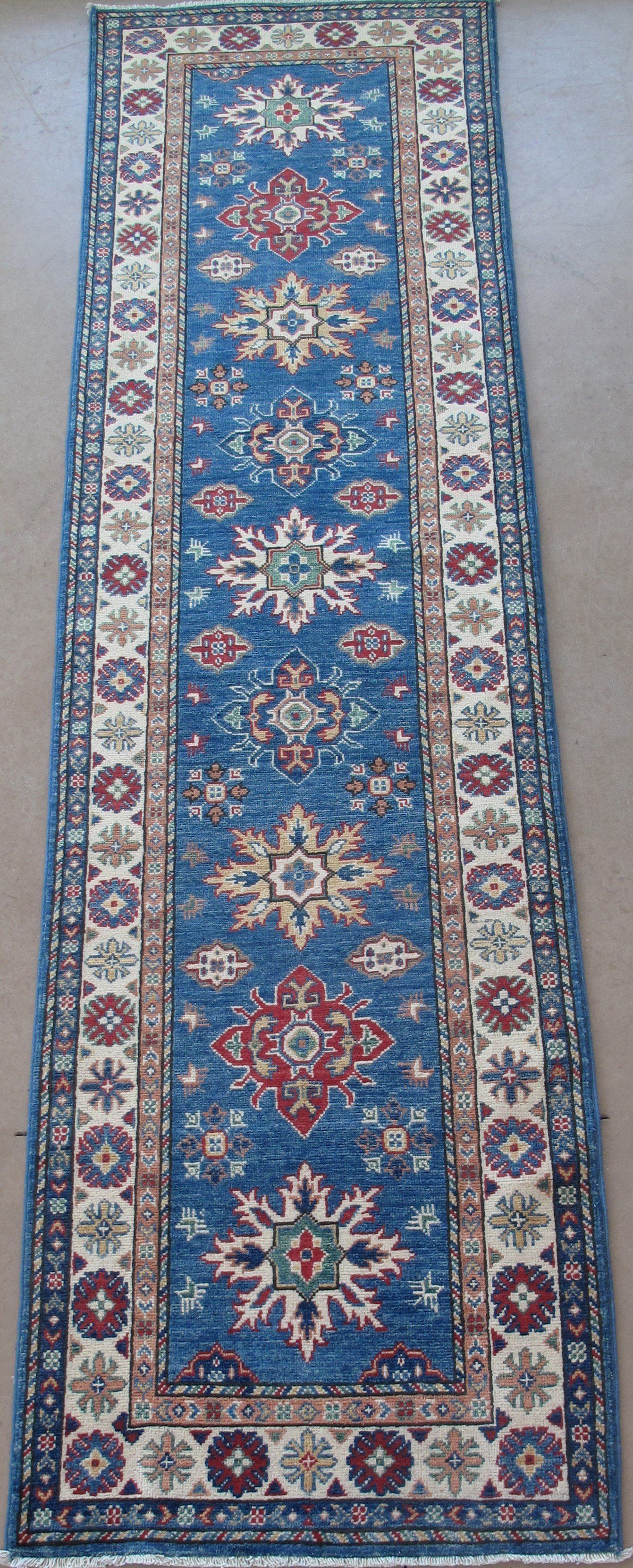A blue rug with a pattern on it is sitting on a table.