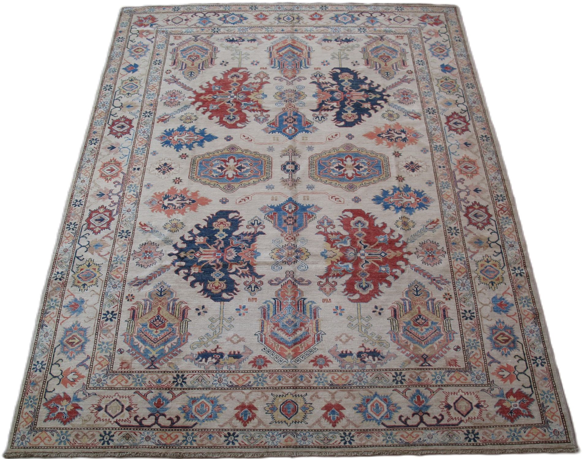 A rug with a floral pattern on it is on a white background.