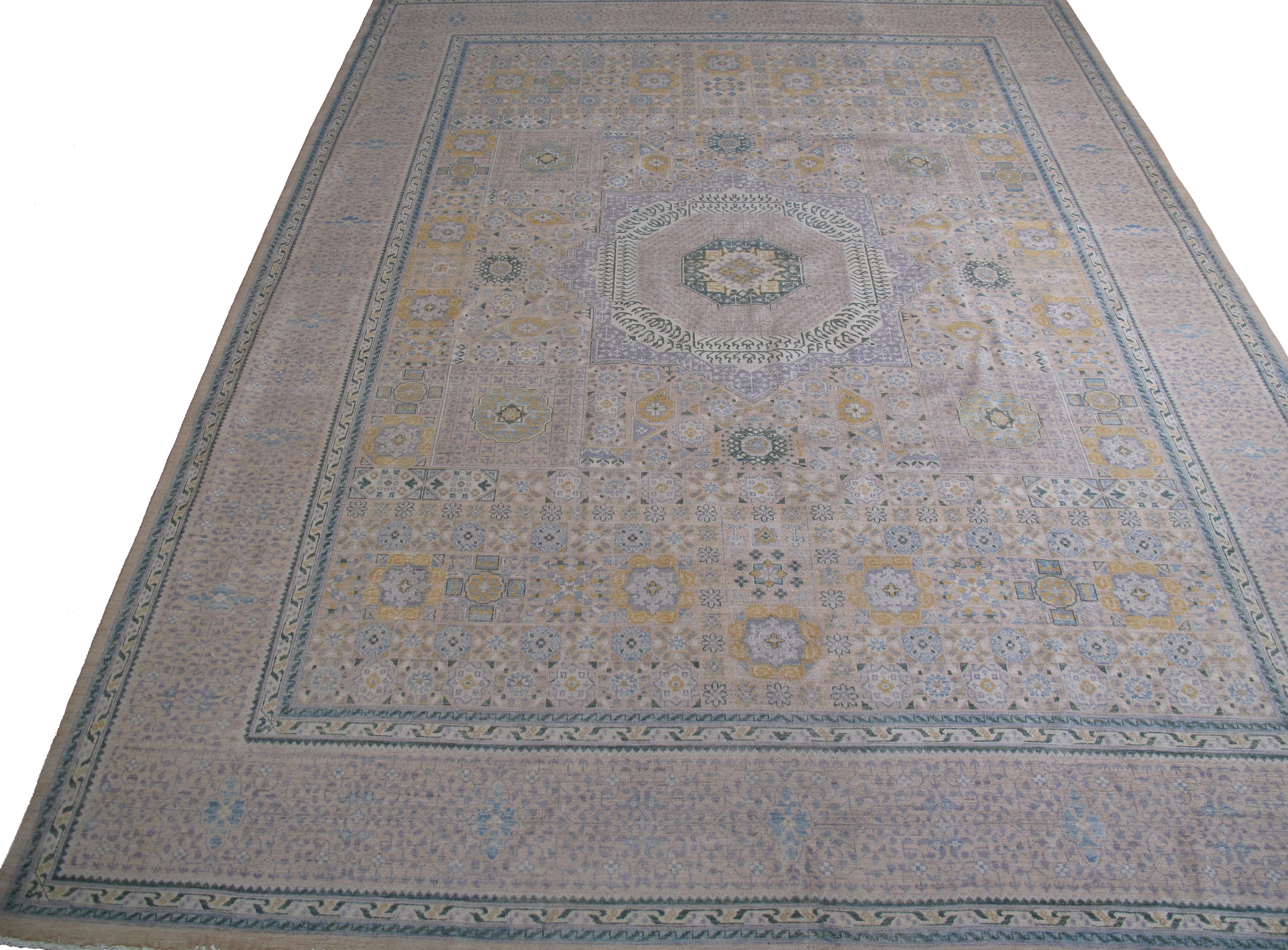 A rug with a floral pattern and a blue border