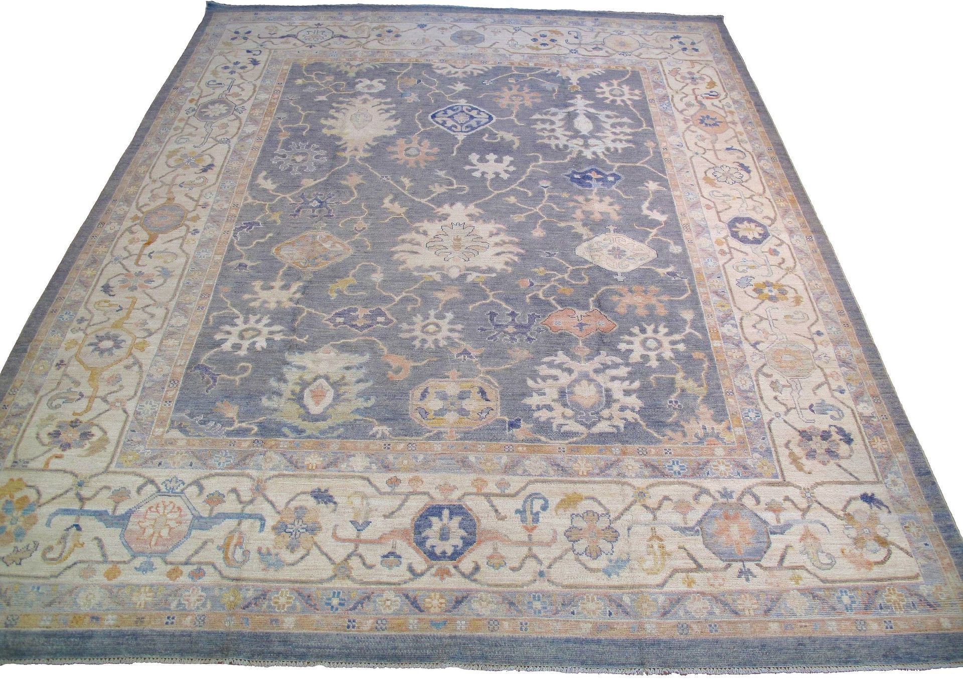 A rug with a floral pattern on it is on a white background