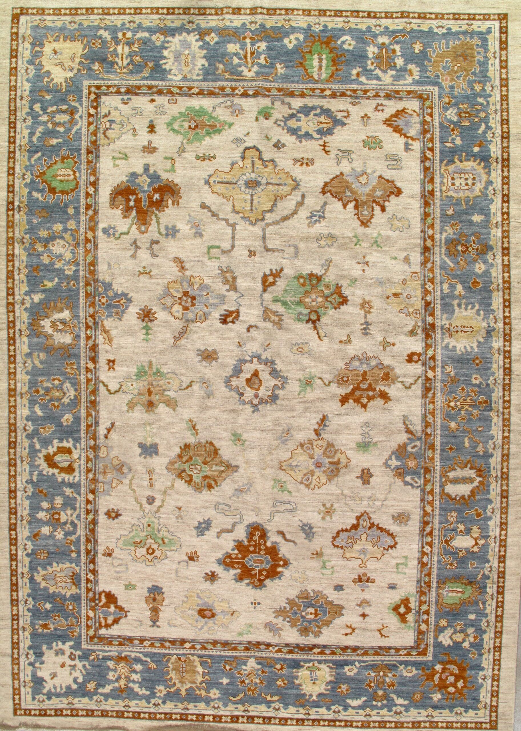A rug with a blue border and a floral pattern