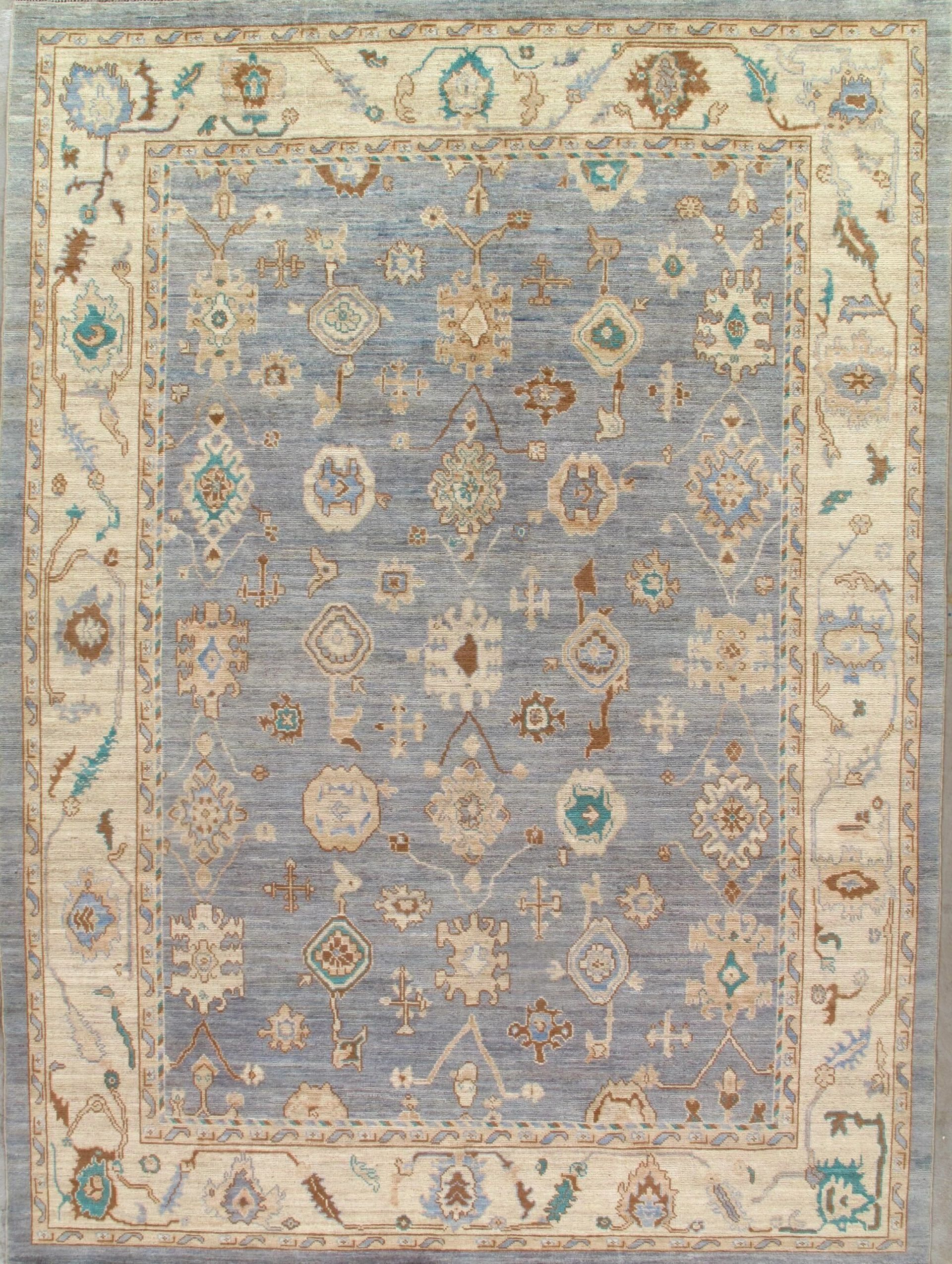 A blue and white rug with a floral pattern on it.