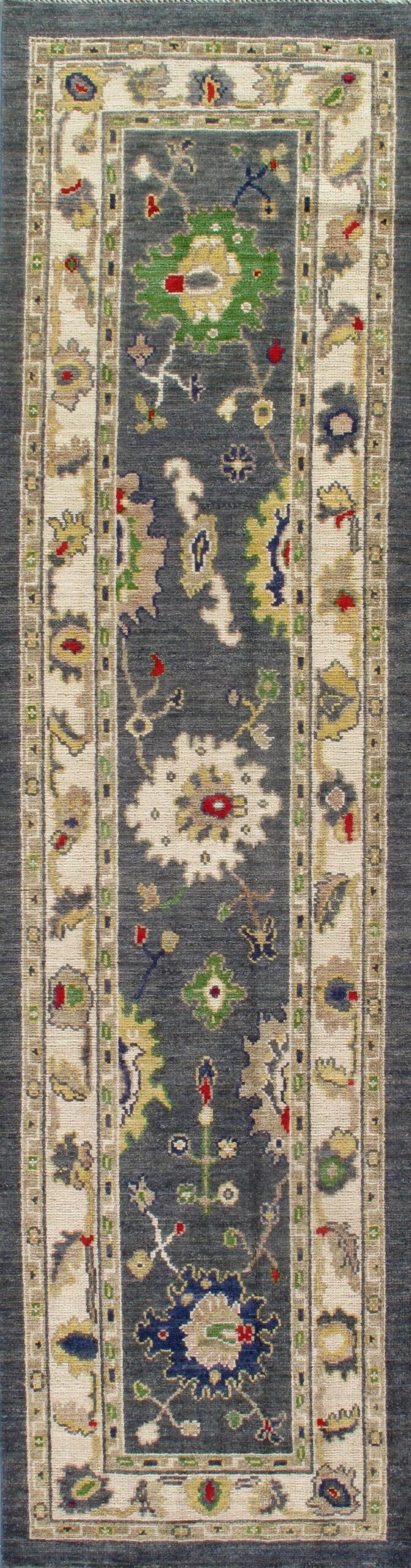 A rug with a floral pattern on it is sitting on a table.