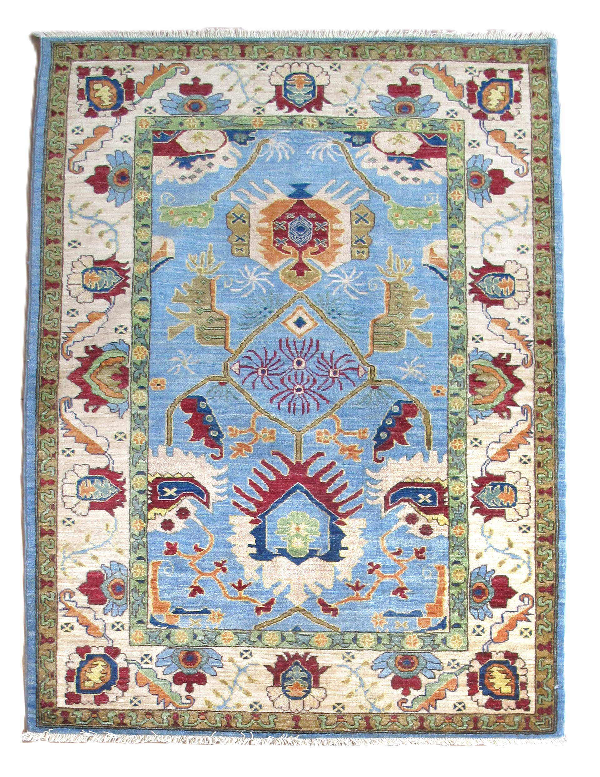 A blue and white rug with a floral pattern on it