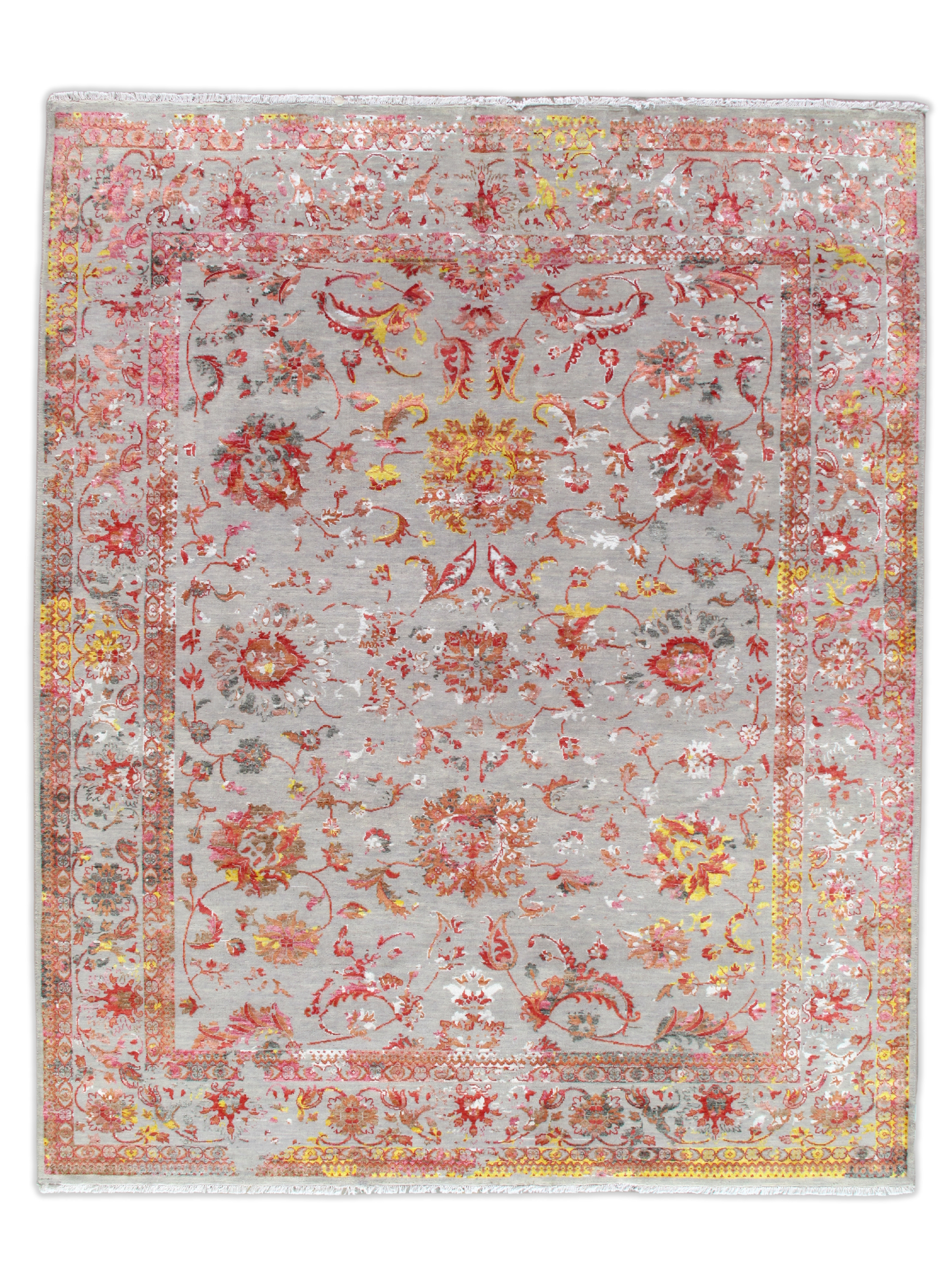 A rug with a floral pattern on it is on a white background.