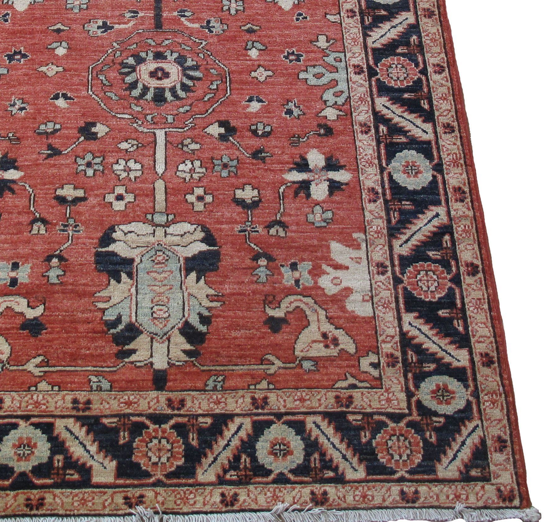 A red rug with a black and white pattern on it