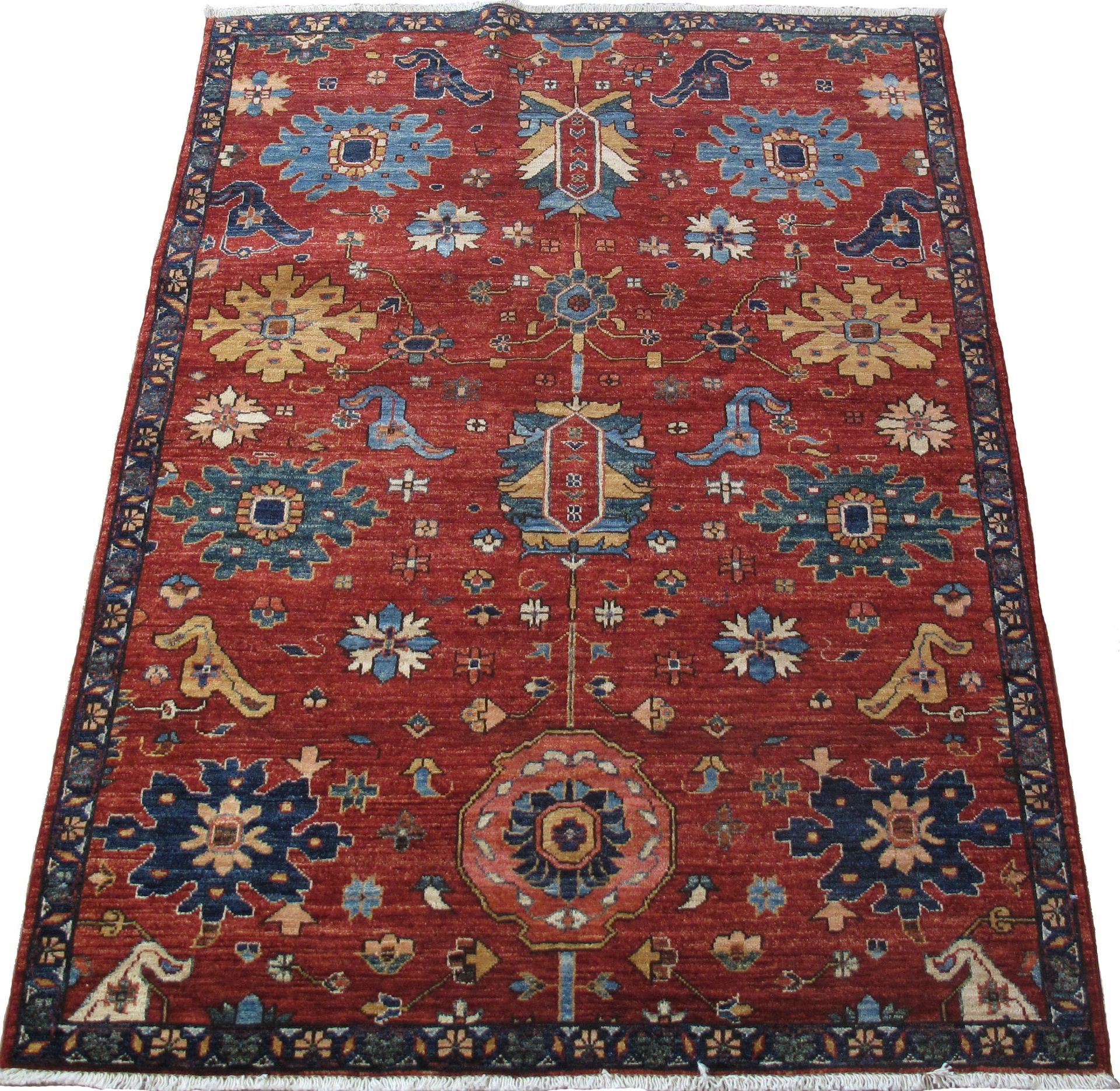A red rug with a blue and yellow pattern on it