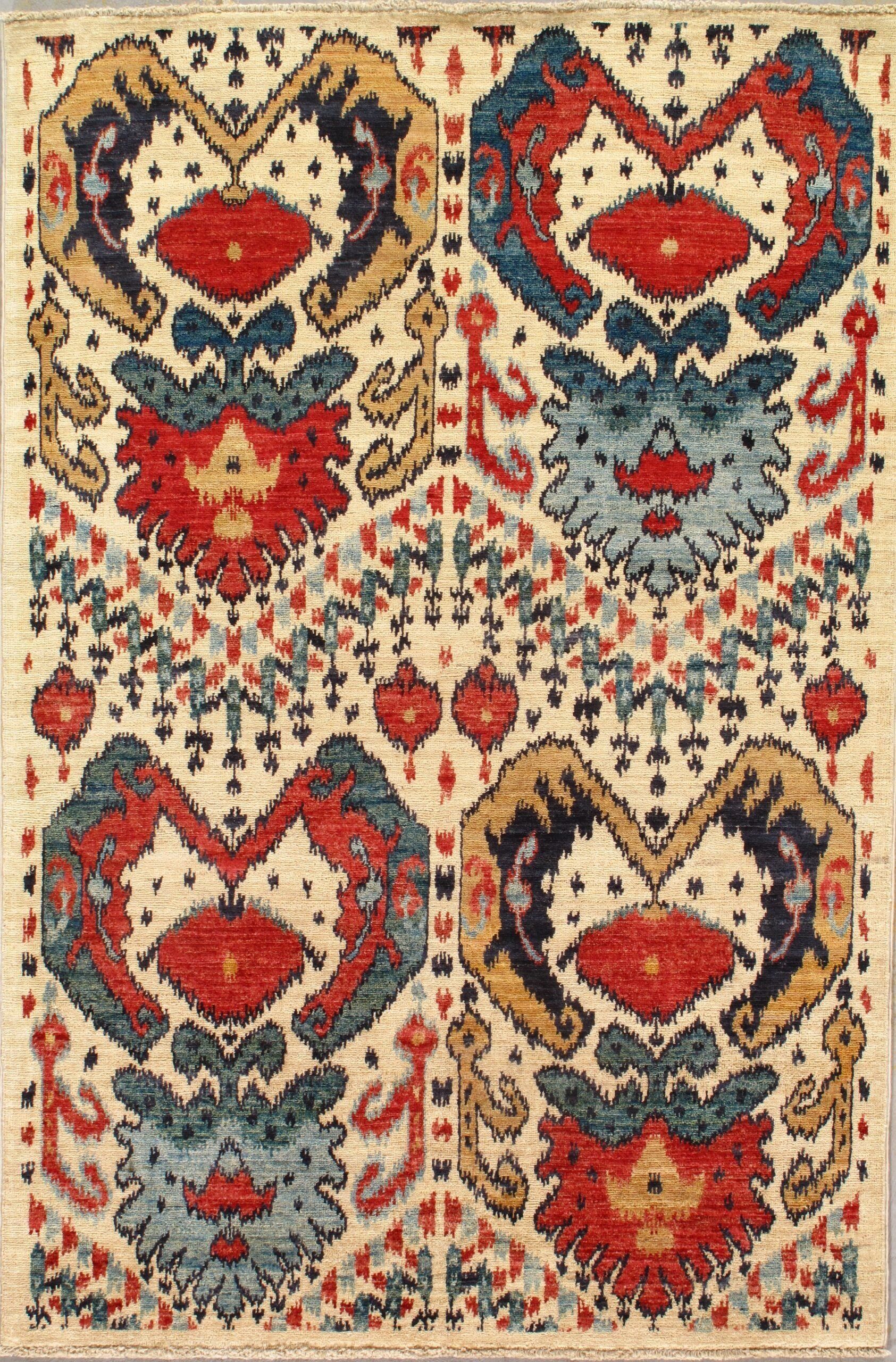 A rug with a pattern of hearts and flowers on it.