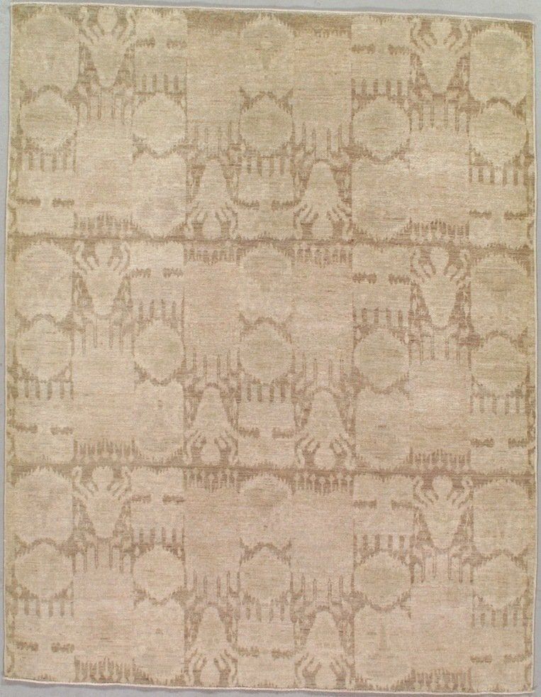 A rug with a pattern of circles and leaves on it