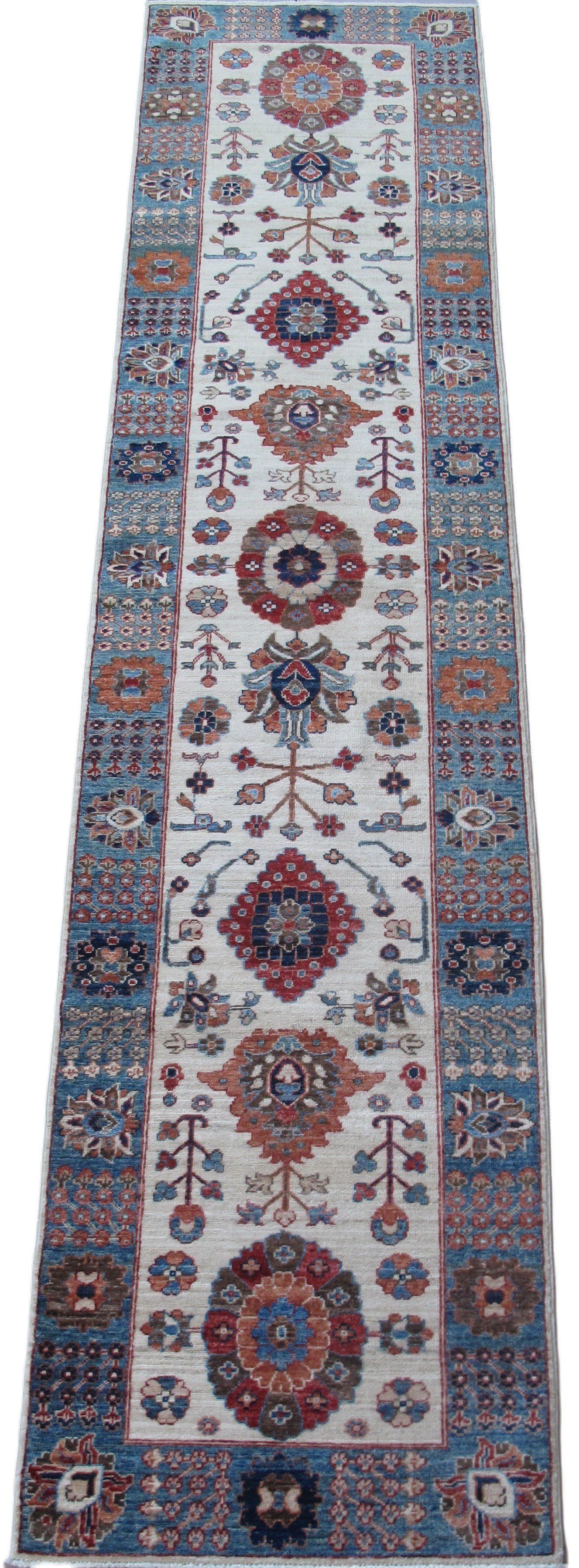 A long rug with a pattern on it is on a white background.