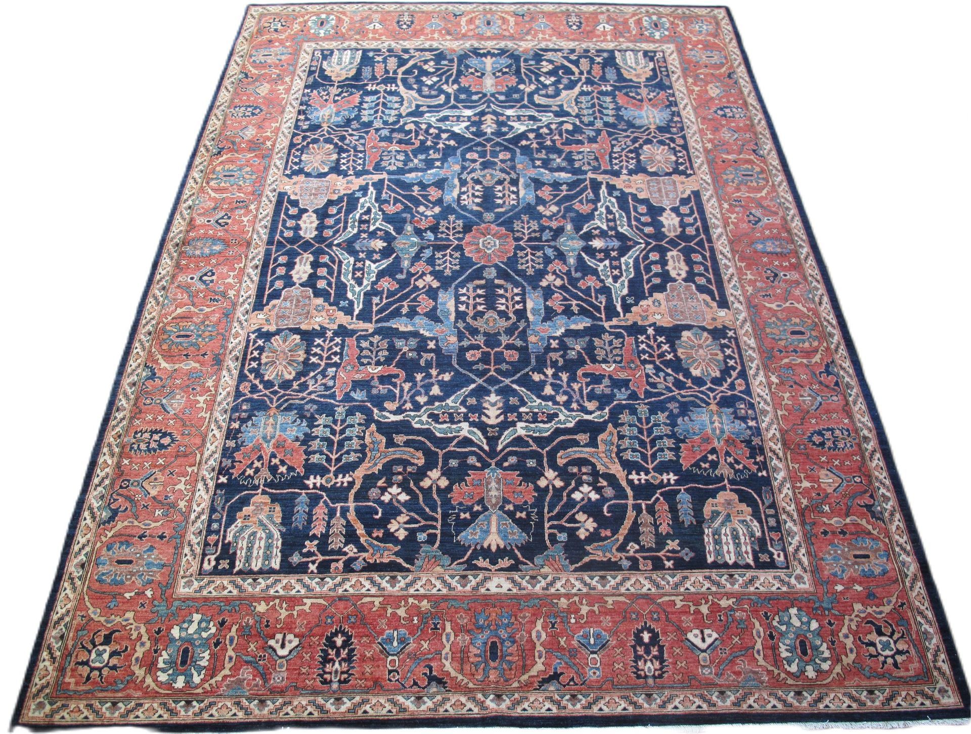 A rug with a floral pattern on it is on a white background.