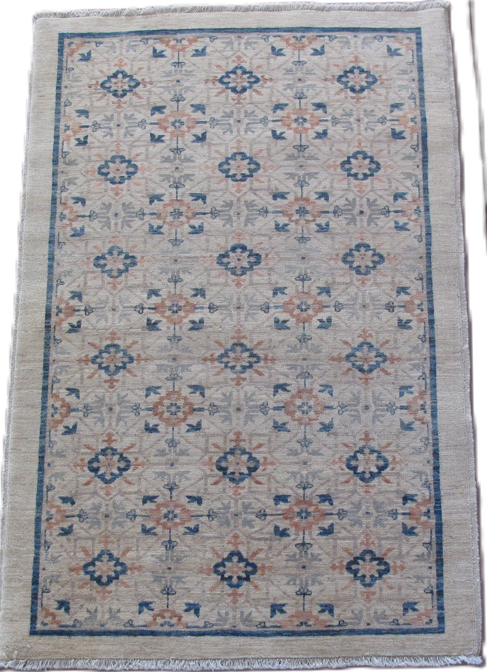 A rug with a blue border and a pattern on it