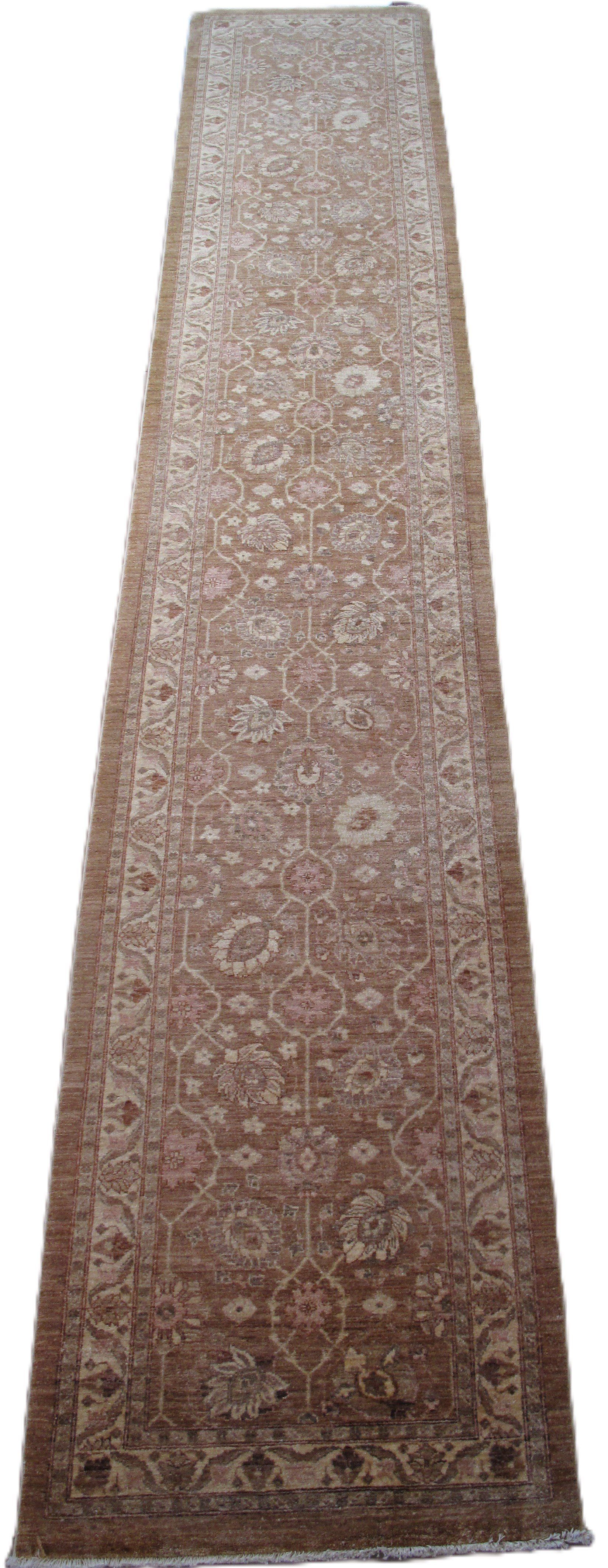 A long brown rug with a floral pattern on a white background.