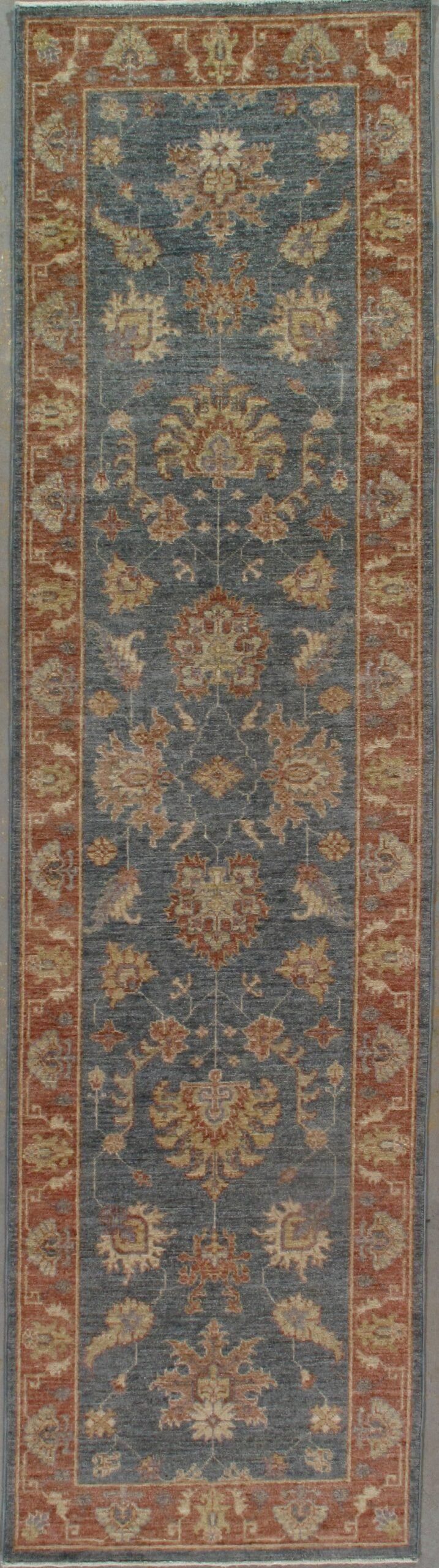 A rug with a floral pattern on it is sitting on a table.