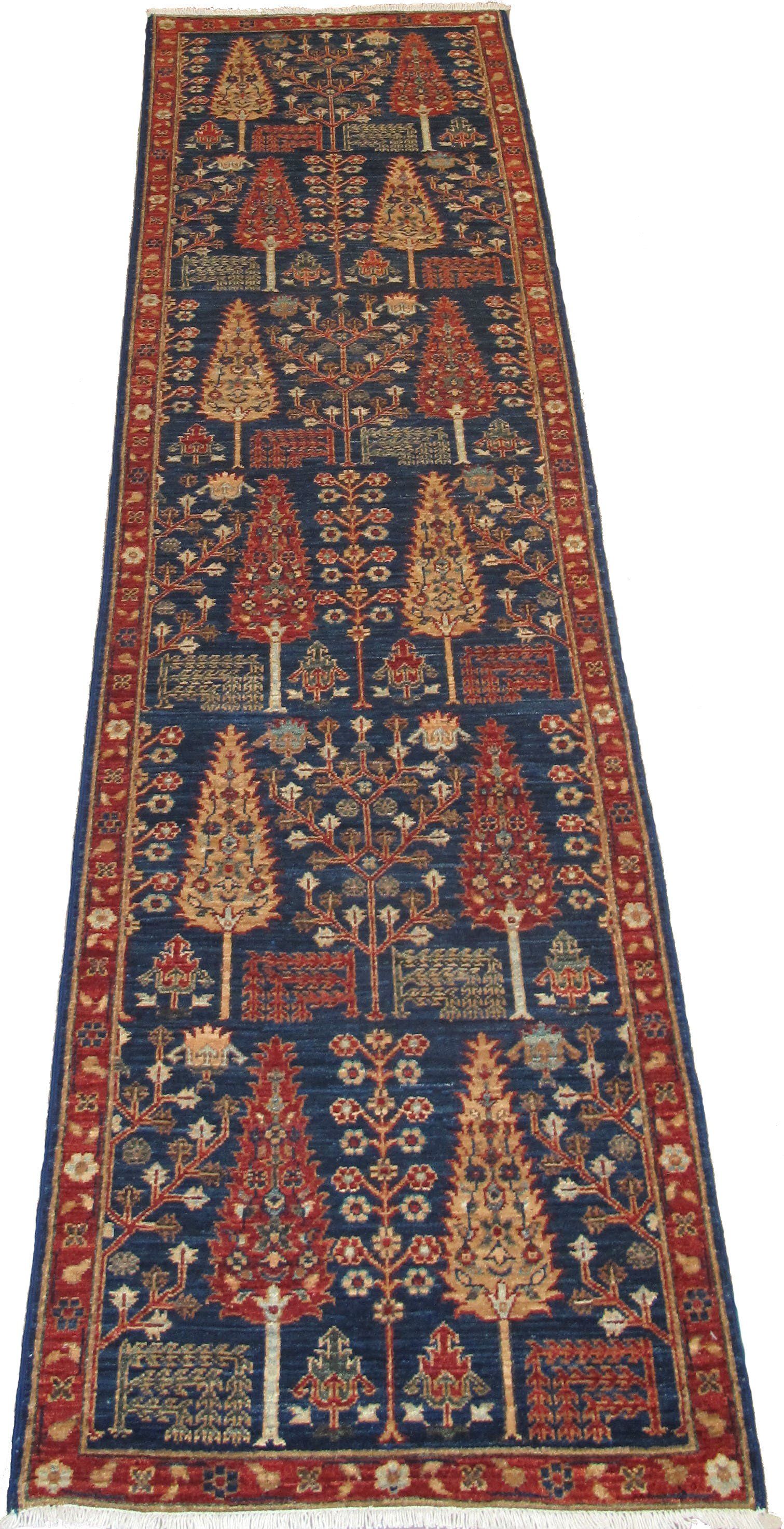 A long rug with trees and flowers on it