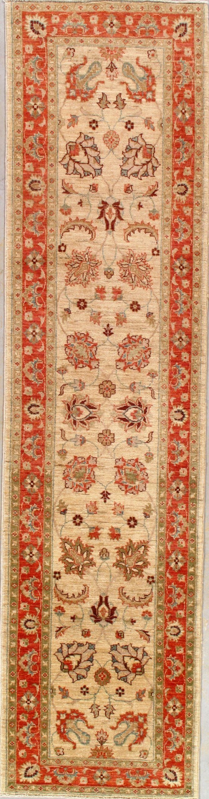 A rug with a red border is sitting on a table.