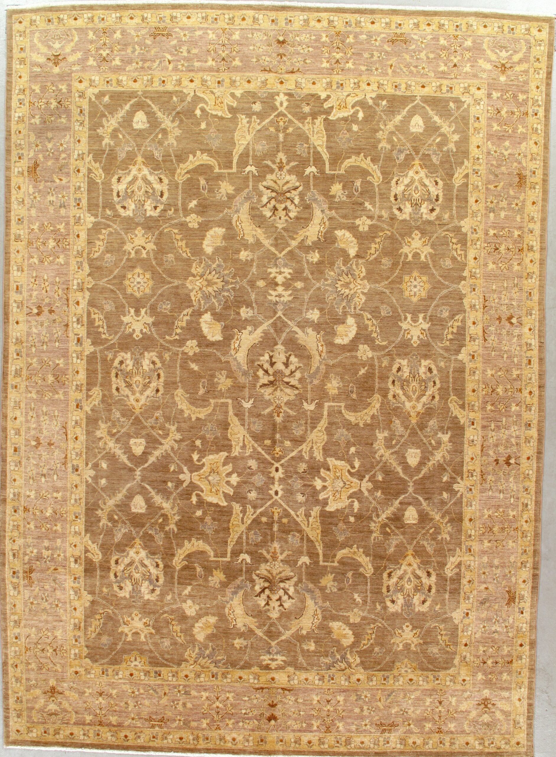 A rug with a floral pattern on it is hanging on a wall.