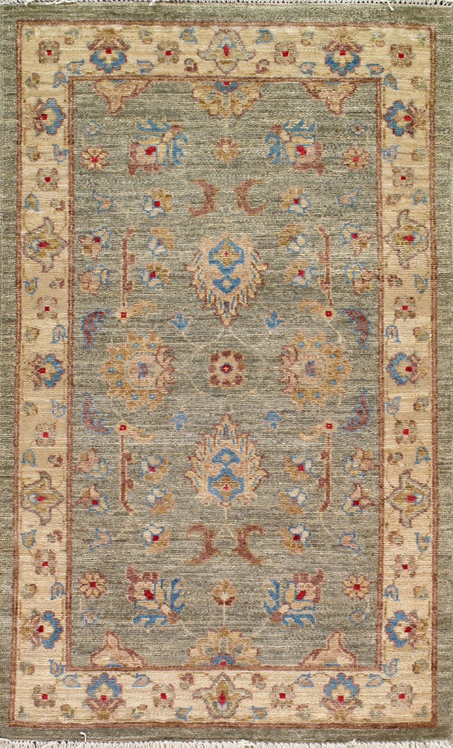 A rug with a floral pattern on it is on a white background.