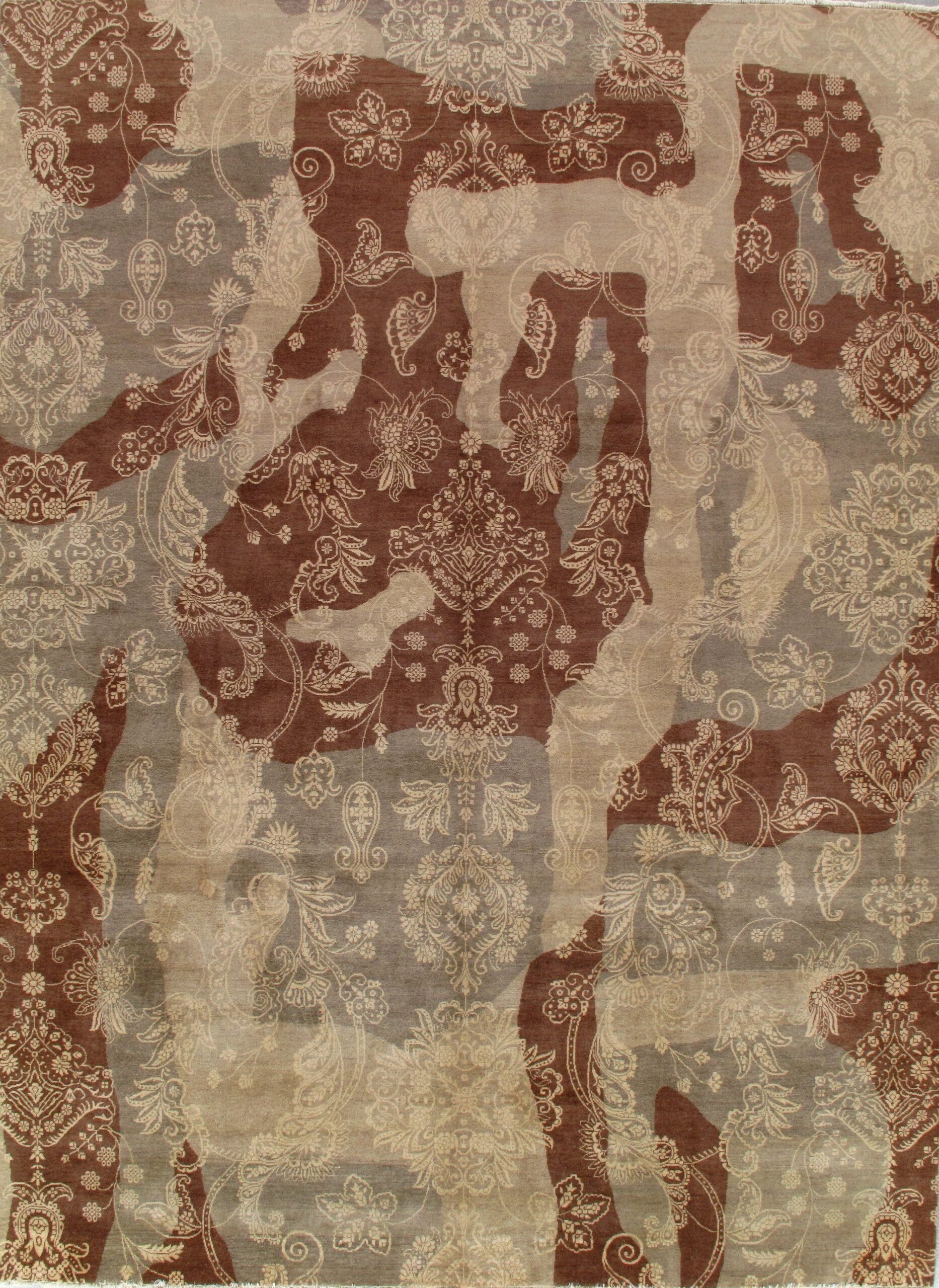 A brown and gray rug with a floral pattern on it