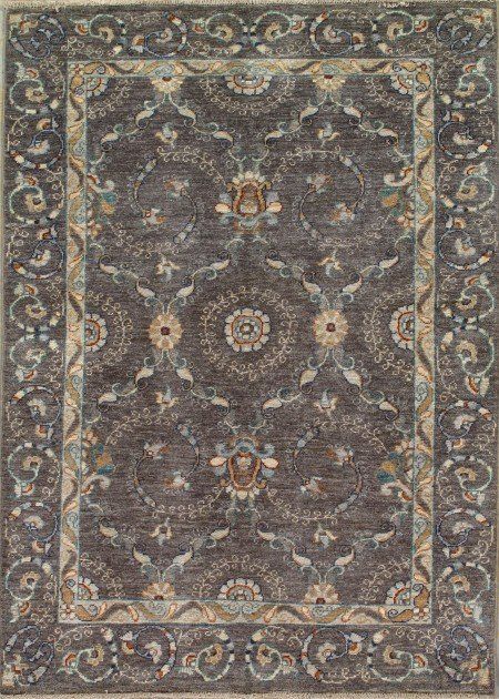 A rug with a floral pattern on it is sitting on a table.