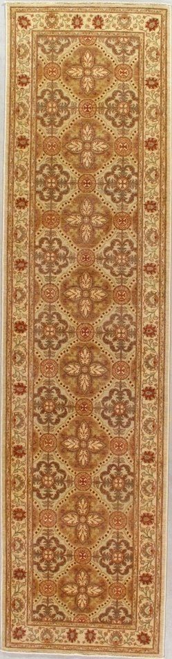 A rug with a pattern on it is hanging on a wall.