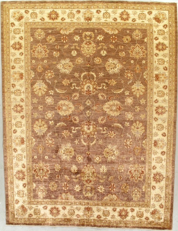 A brown and white rug with a floral pattern on it