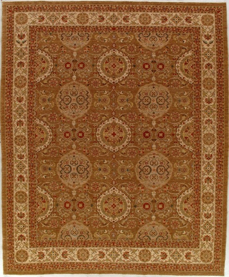 A brown rug with a pattern on it is on a white background.