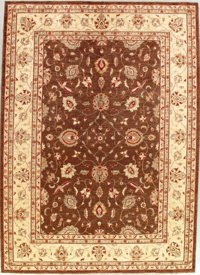 A brown rug with a floral pattern on it