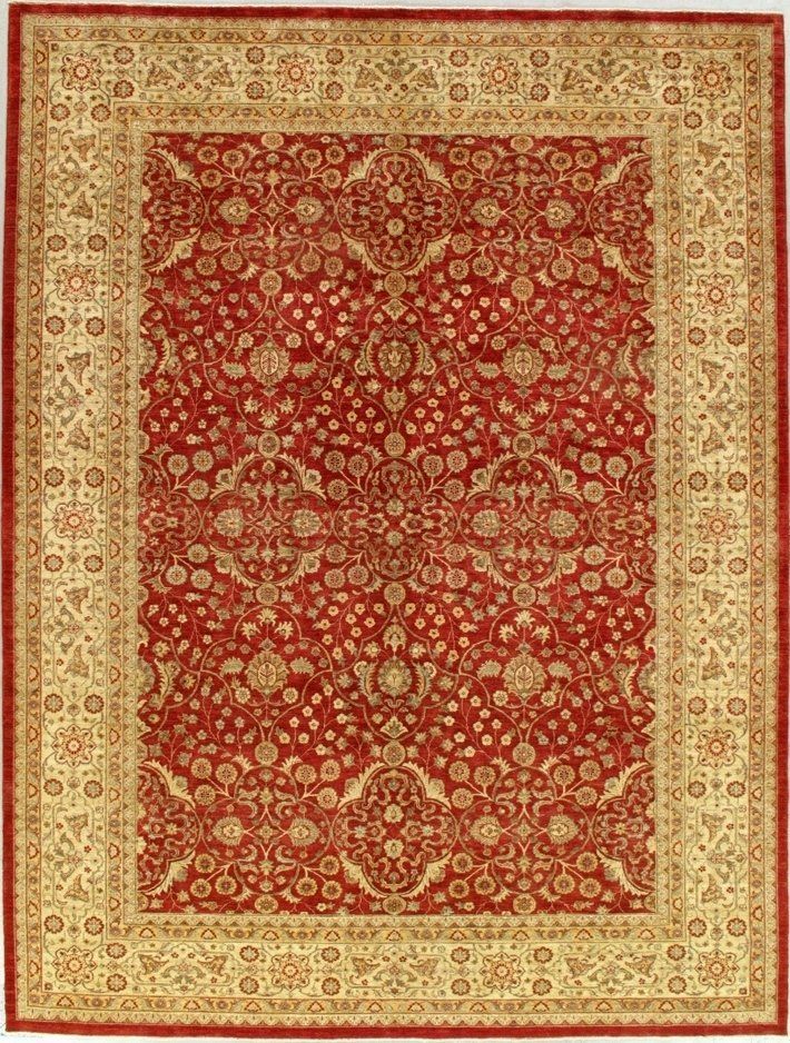 A red and gold rug with a floral pattern on it