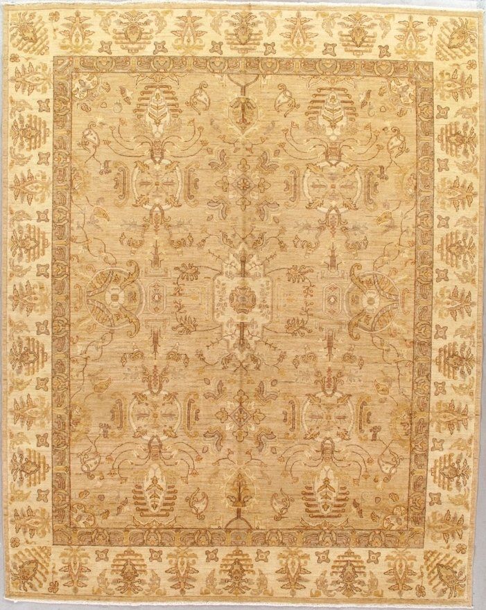 A rug with a floral pattern on it is hanging on a wall.