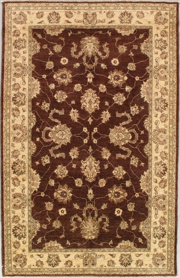 A brown rug with a floral pattern on it