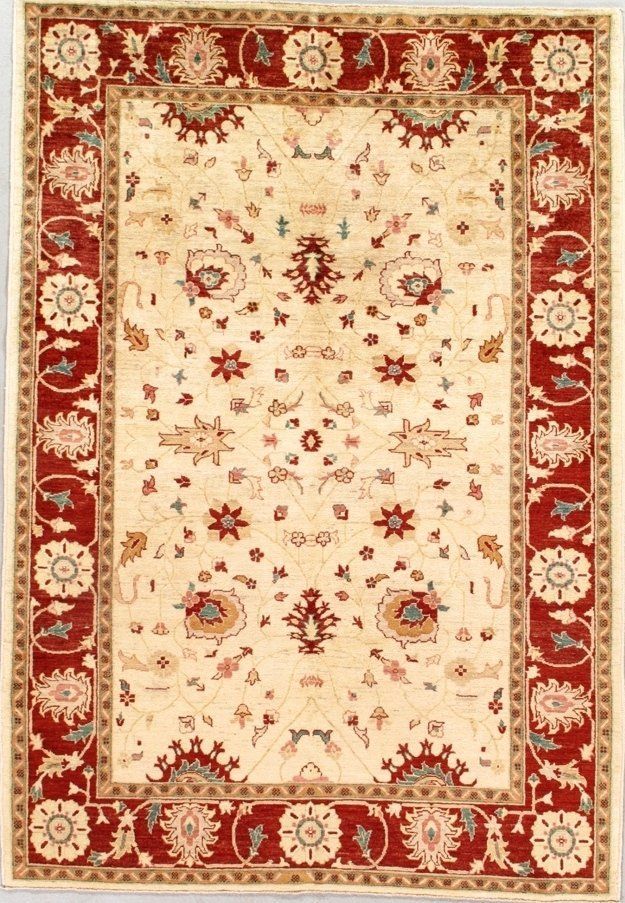 A rug with a red border and a white border