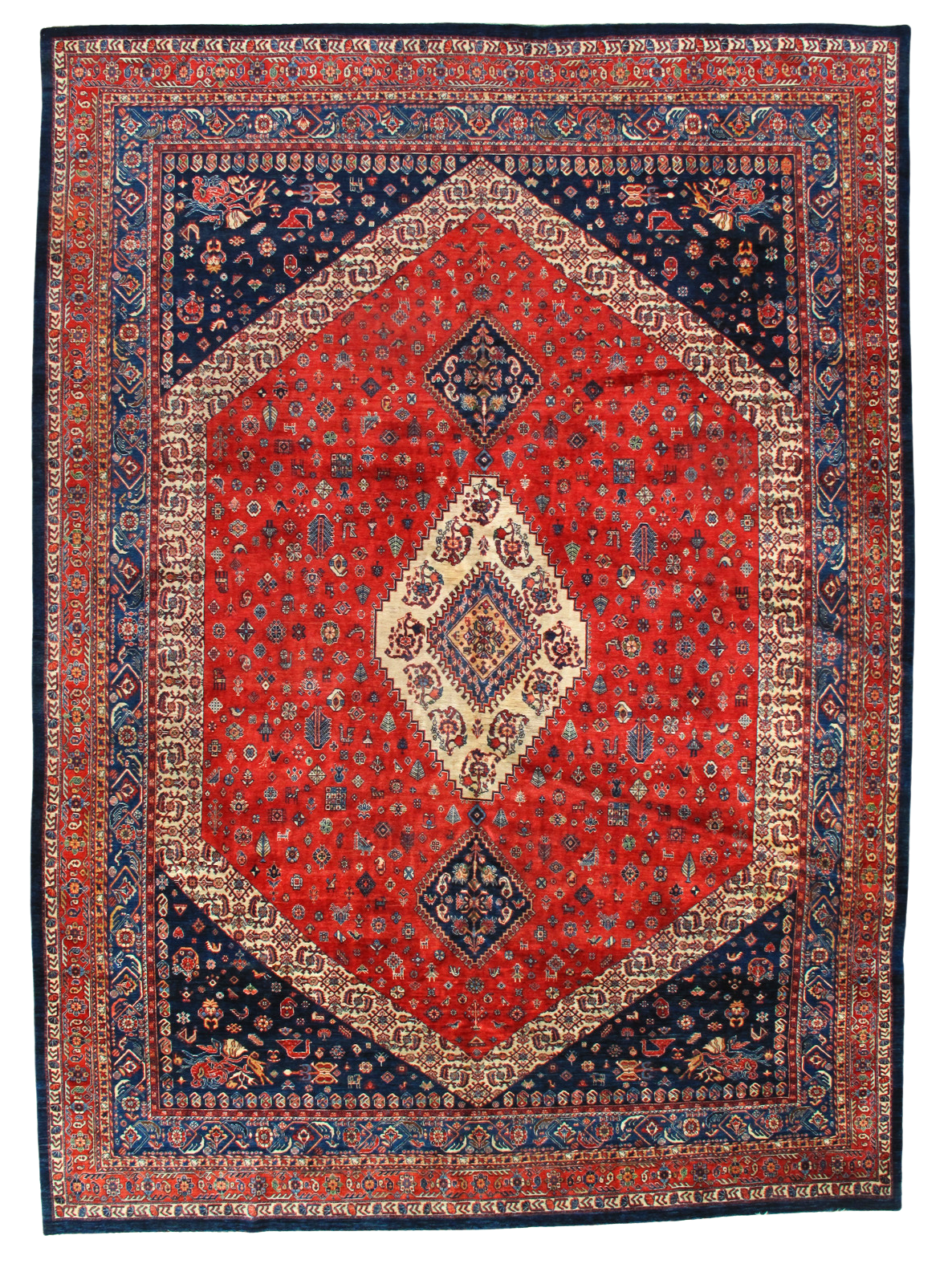 A red and blue rug with a diamond pattern on it