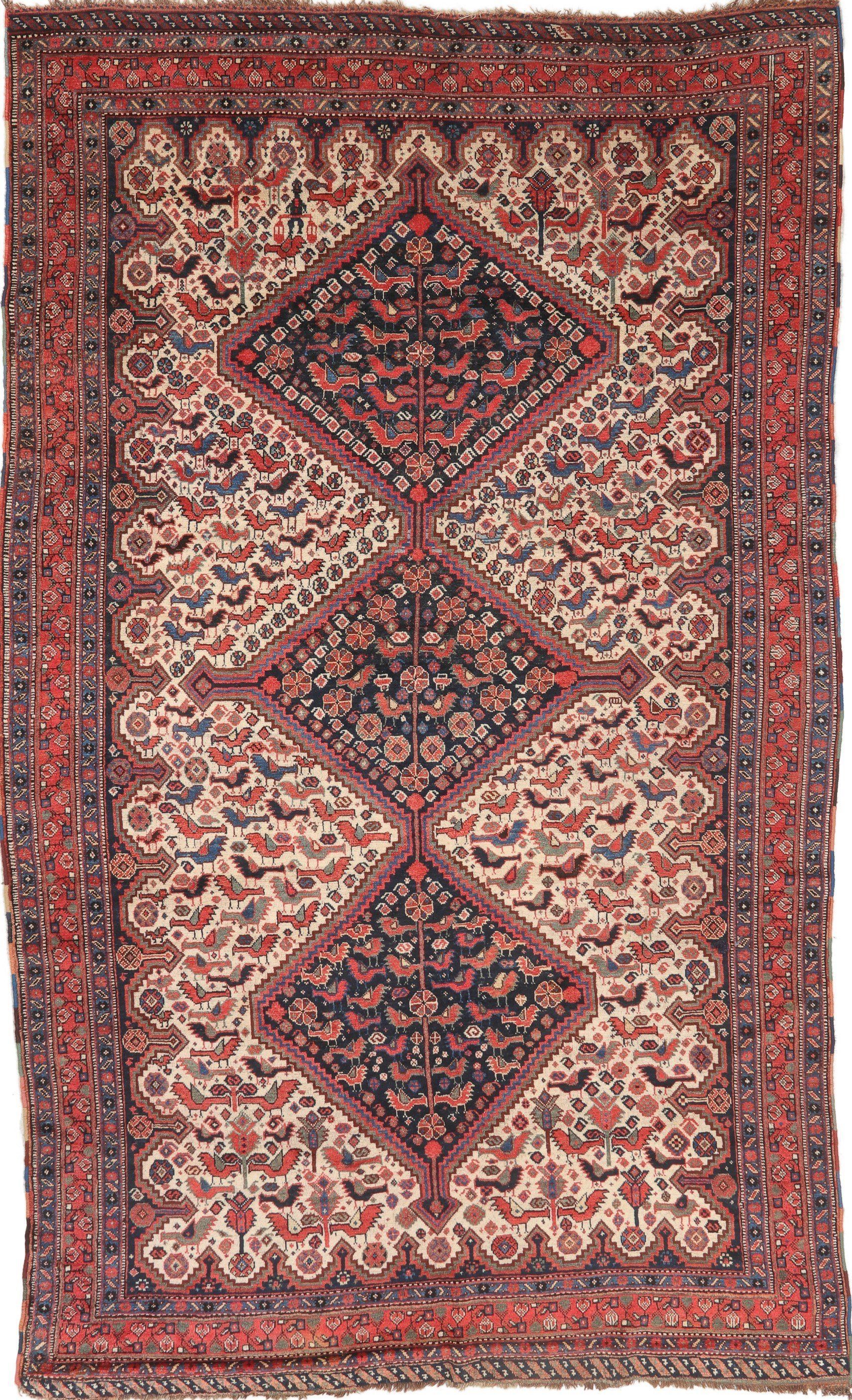 A rug with a floral pattern on it is on a white background.
