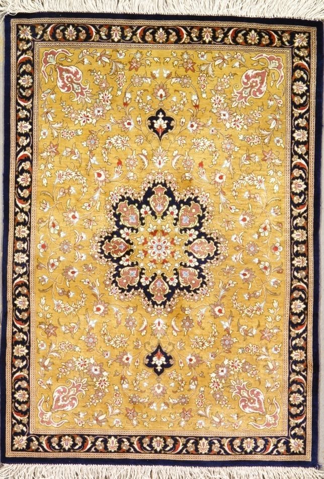 Yellow and navy oriental rug with floral patterns and border.