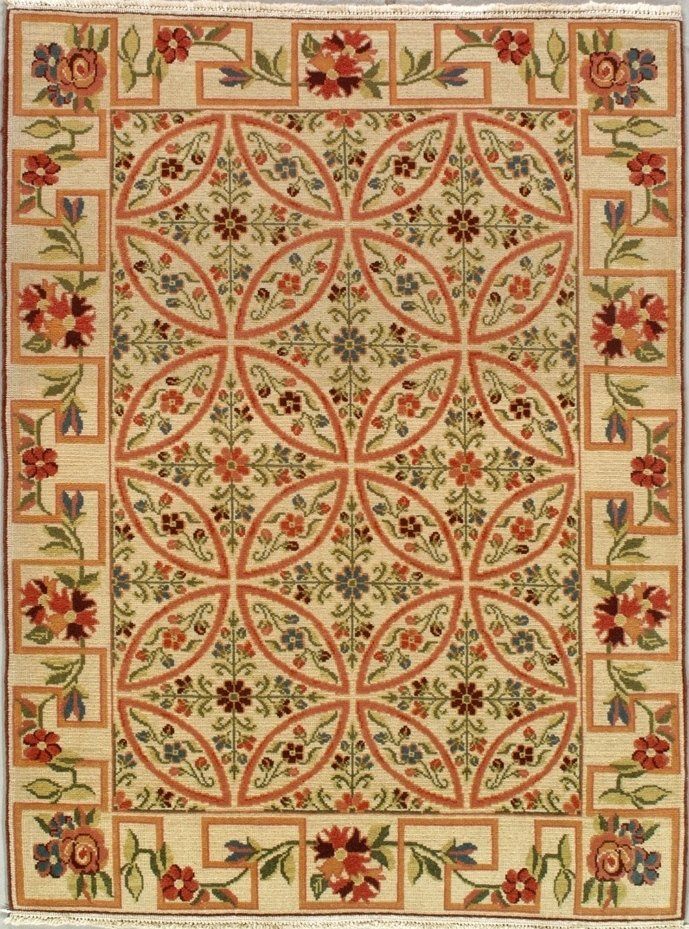A rug with flowers and leaves on it