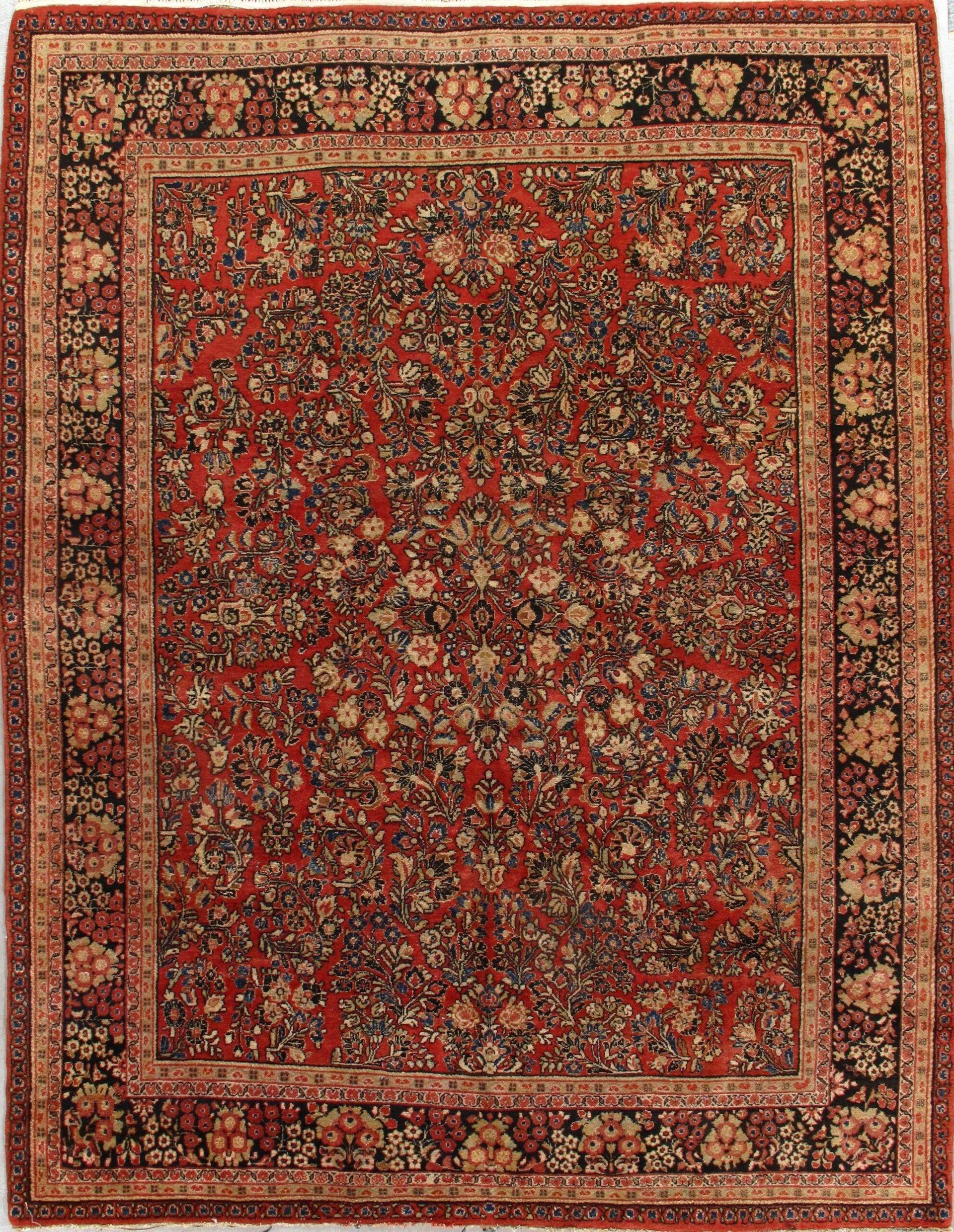 A rug with a floral pattern and a square frame on a white background.