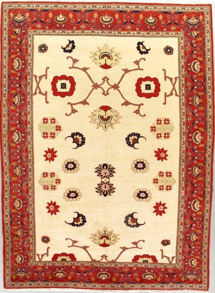 A rug with a red border has a floral pattern on it