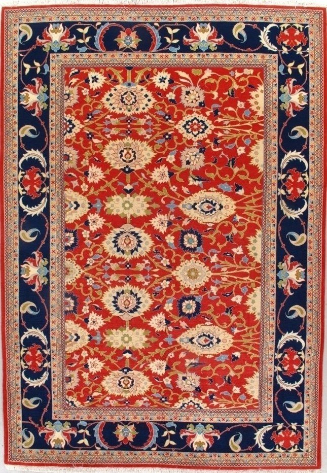 A red and blue rug with a floral pattern