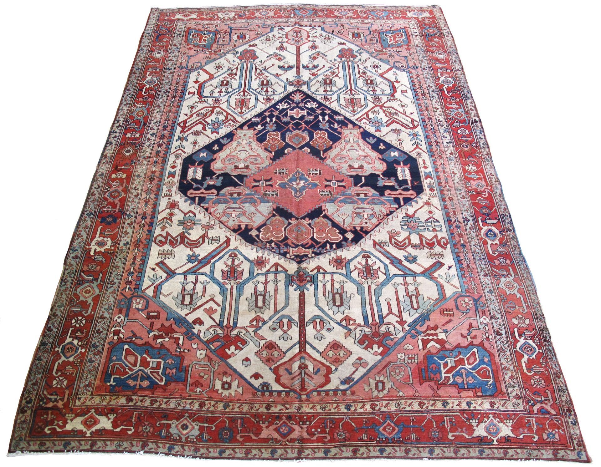 A rug with a pattern on it is sitting on a white surface.