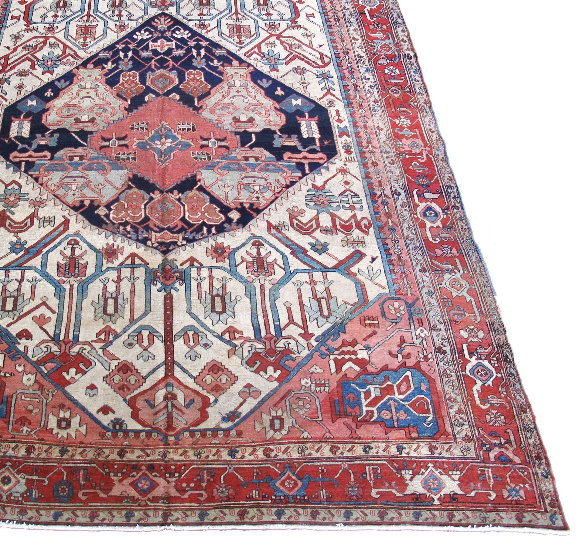 A rug with a pattern on it is sitting on a white surface.