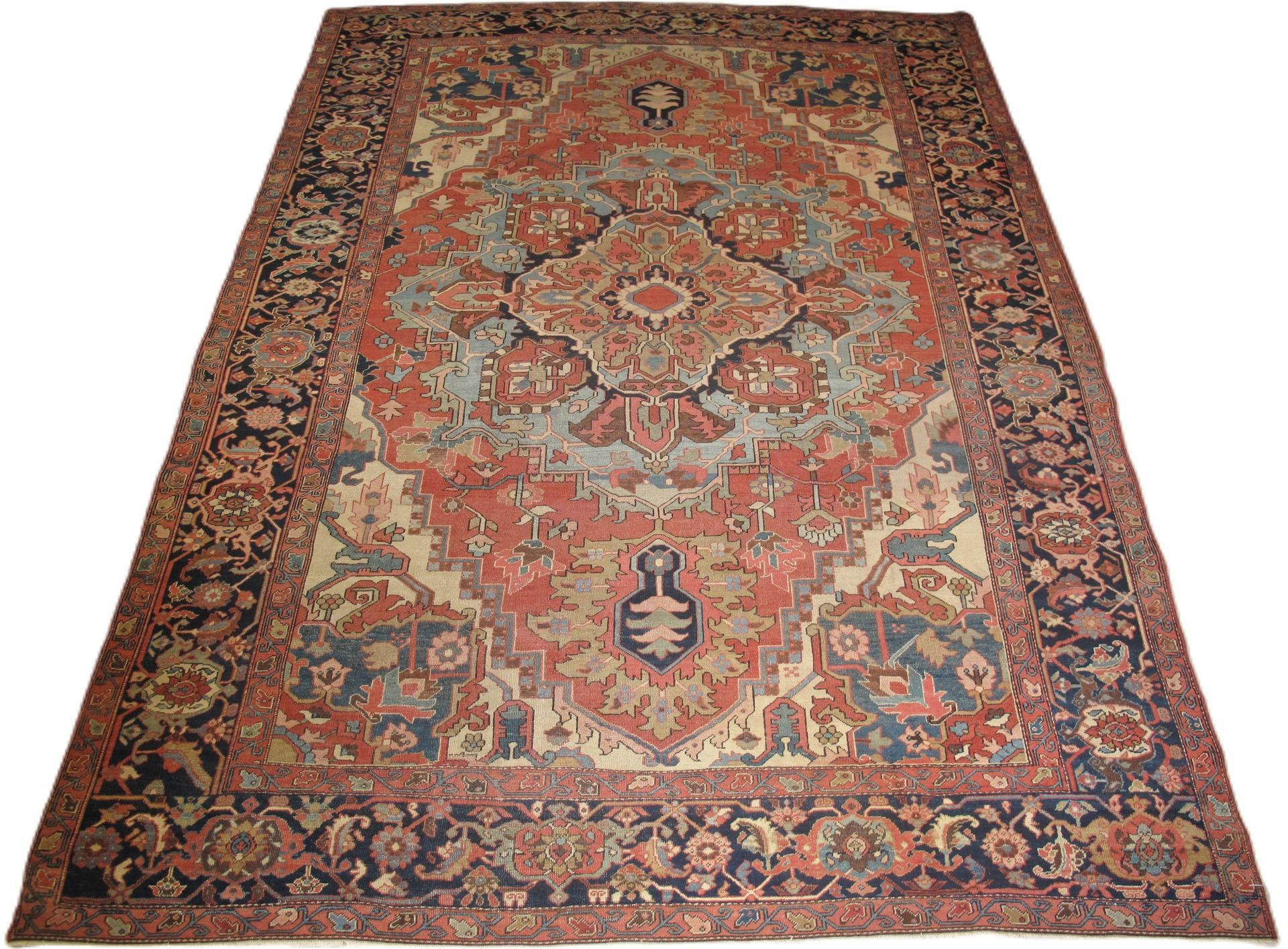 A rug with a floral pattern on it is on a white background
